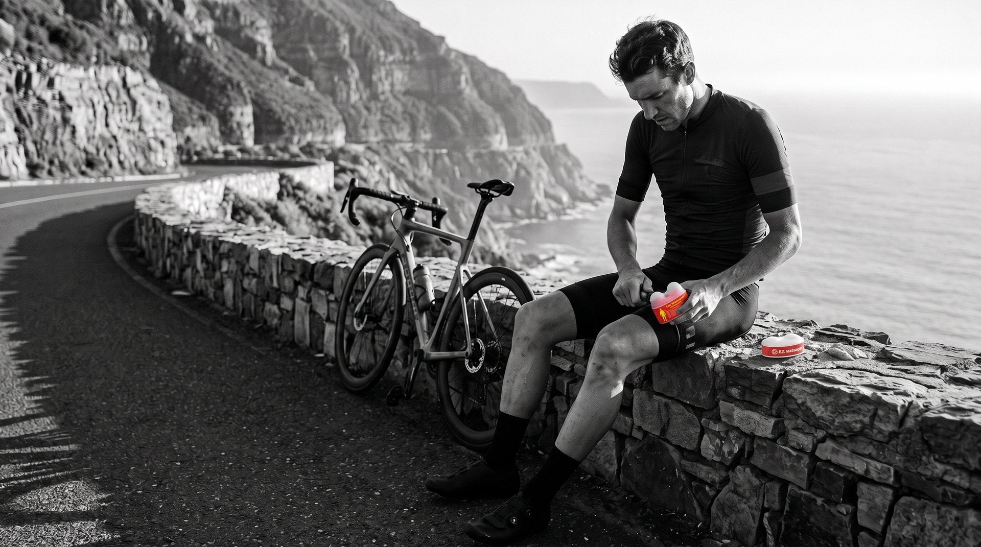 Cyclist rolling a quad beside a coastal road