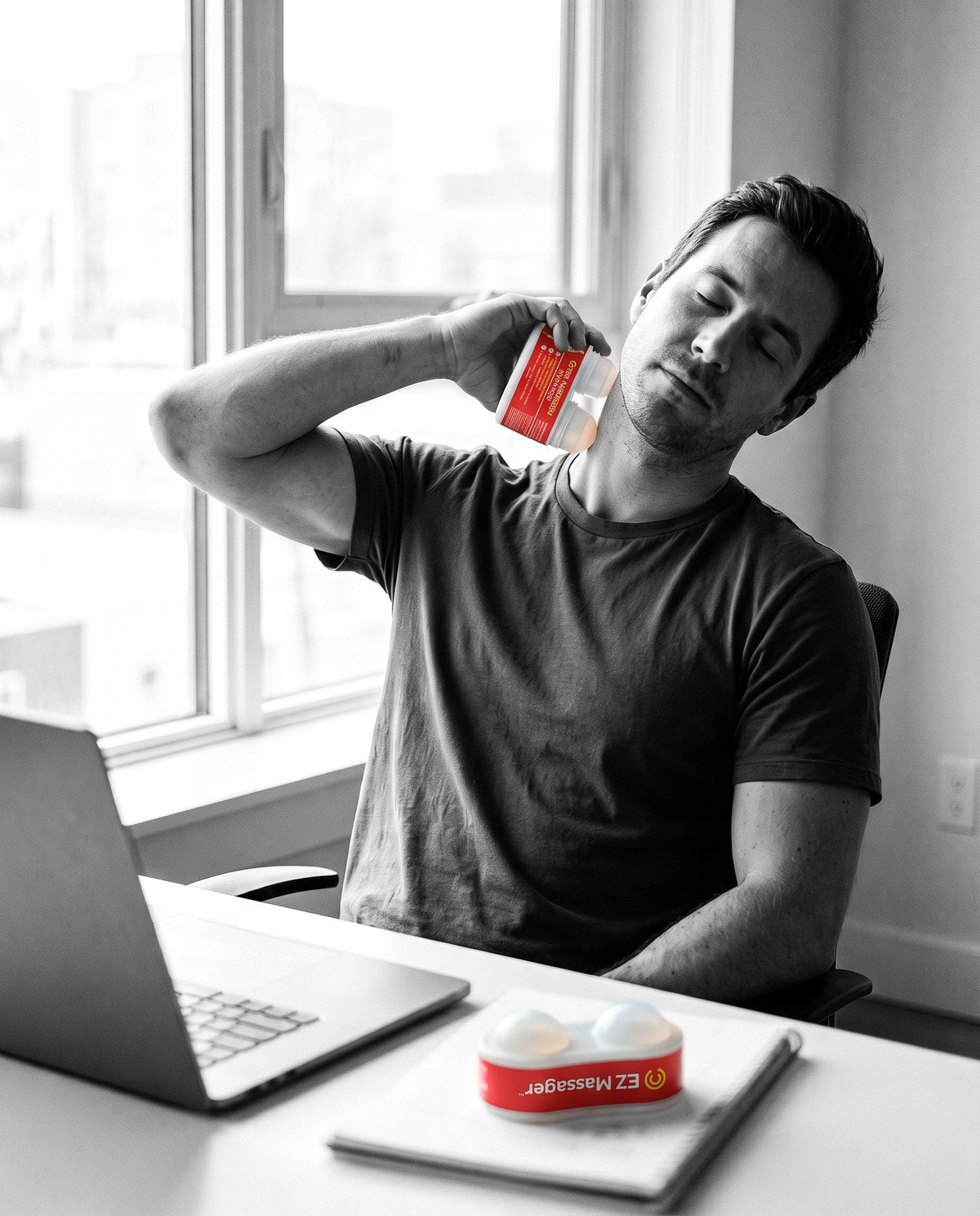 Person at a desk rolling the side of their neck