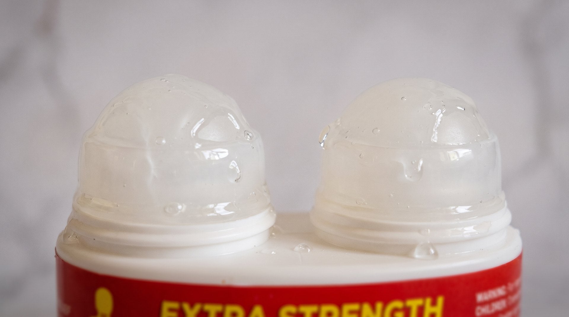 Close-up of the two roller balls with a sheen of gel